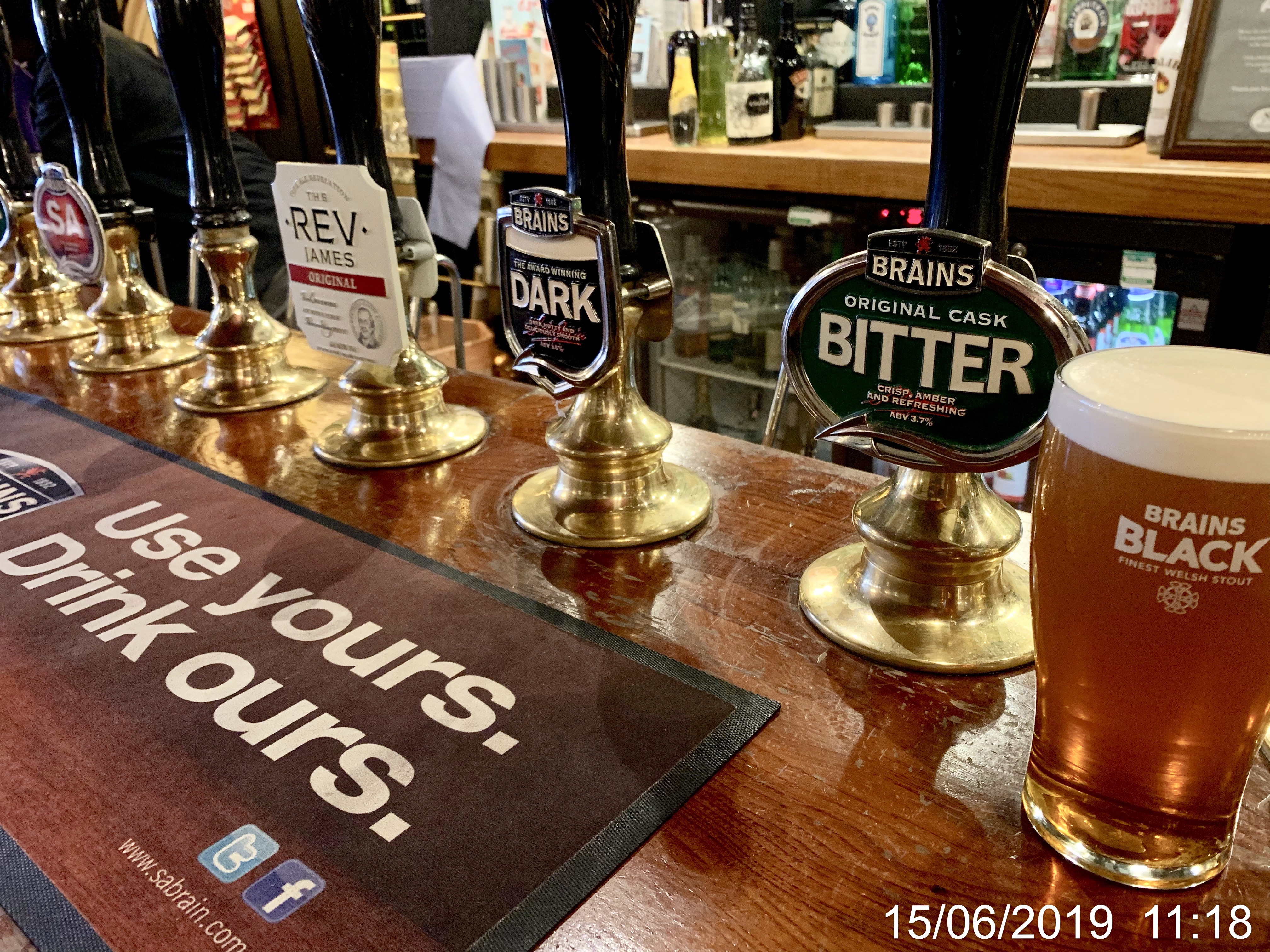 A row of Brains hand pumps in The Cottage, Cardiff. 
